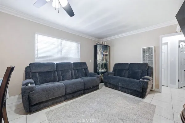a living room with a couch and a dresser