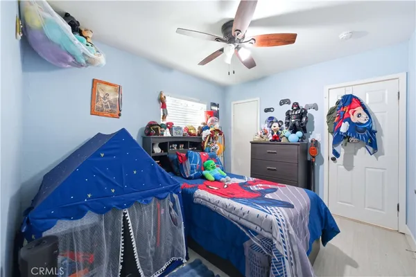 a bedroom with bed and window