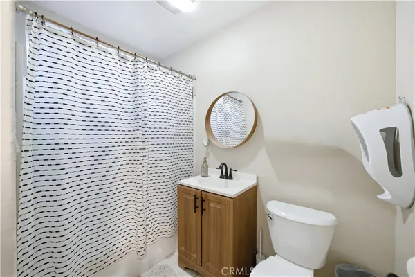 a bedroom with a bed and cabinets