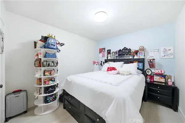 a bedroom with a bed and closet