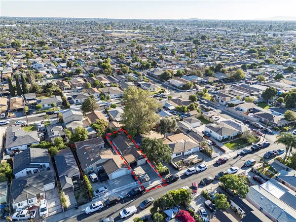 an aerial view of residential houses with outdoor space