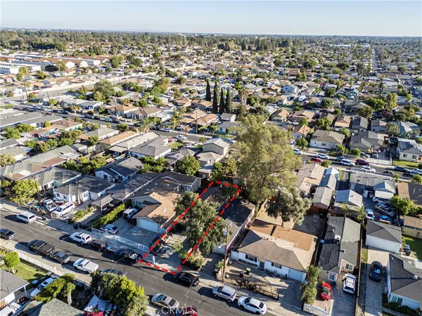 an aerial view of residential houses with outdoor space