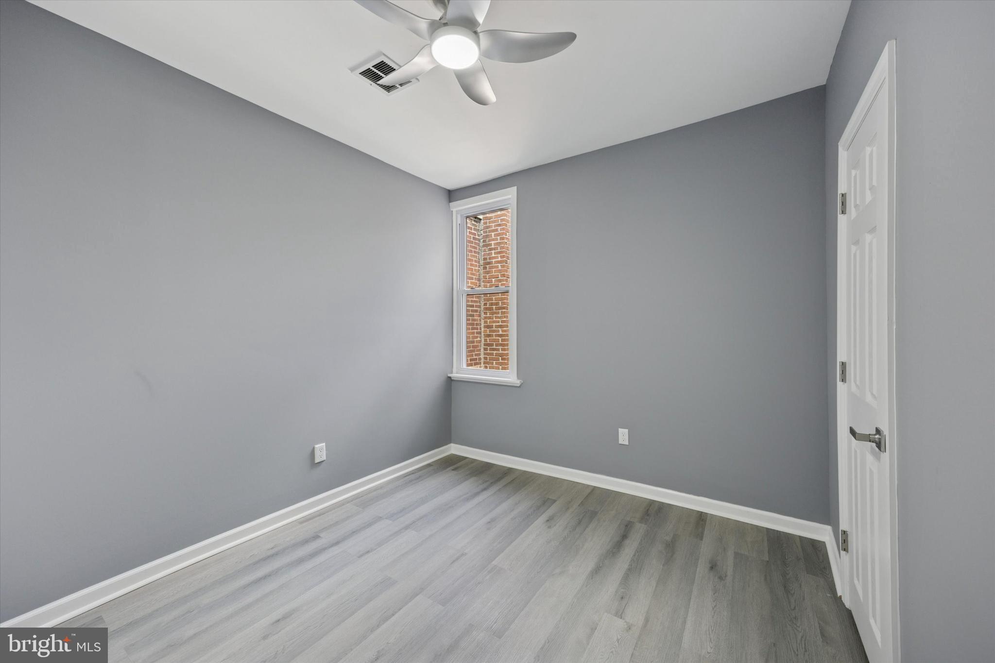 5407 Arlington Street Philadelphia, PA 19131 - Photo 11 of 15 wooden floor in an empty room with a window