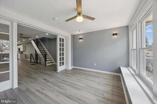 a view of an entryway with wooden floor