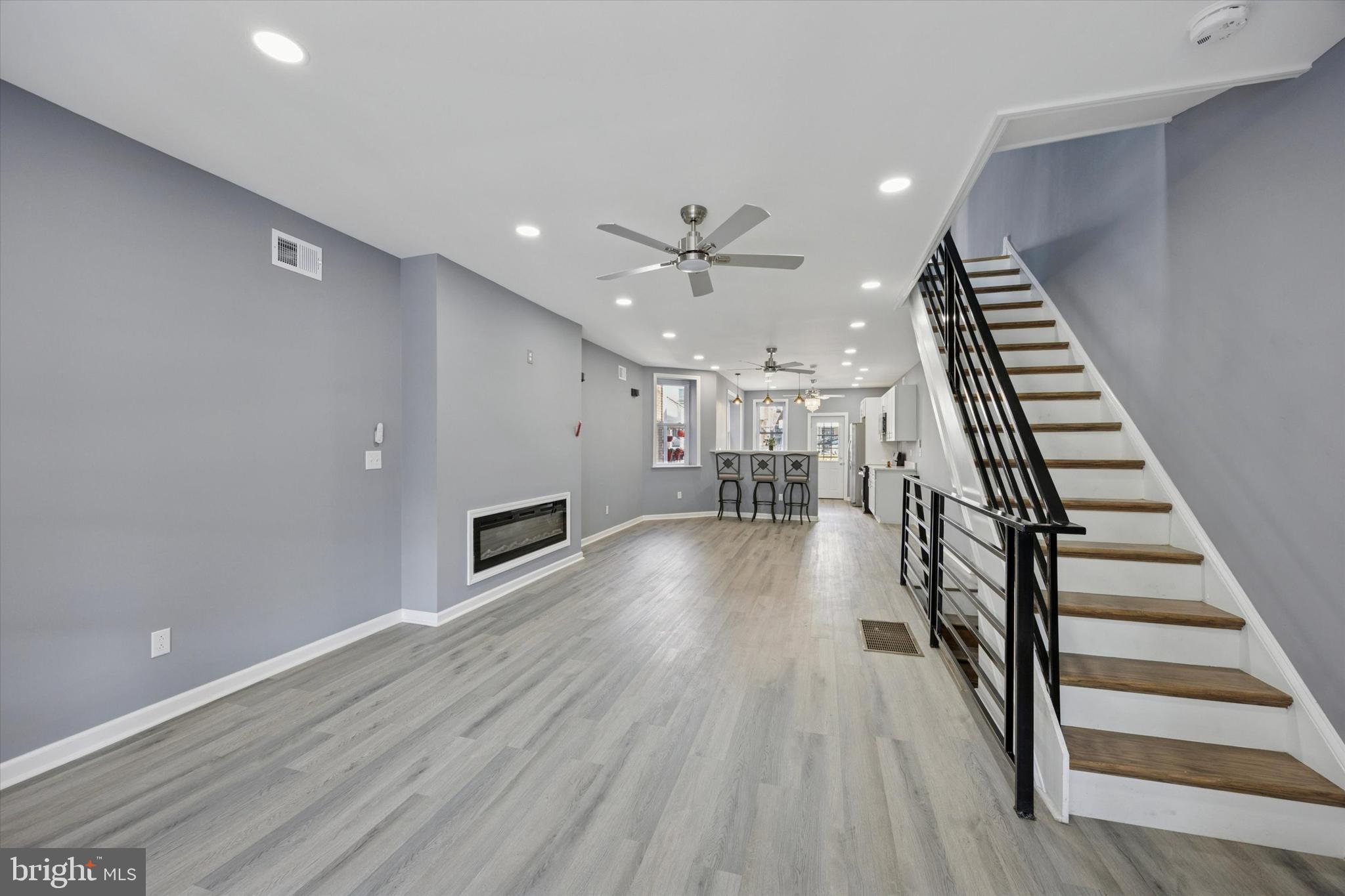 5407 Arlington Street Philadelphia, PA 19131 - Photo 4 of 15 wooden floor in an empty room with a fireplace