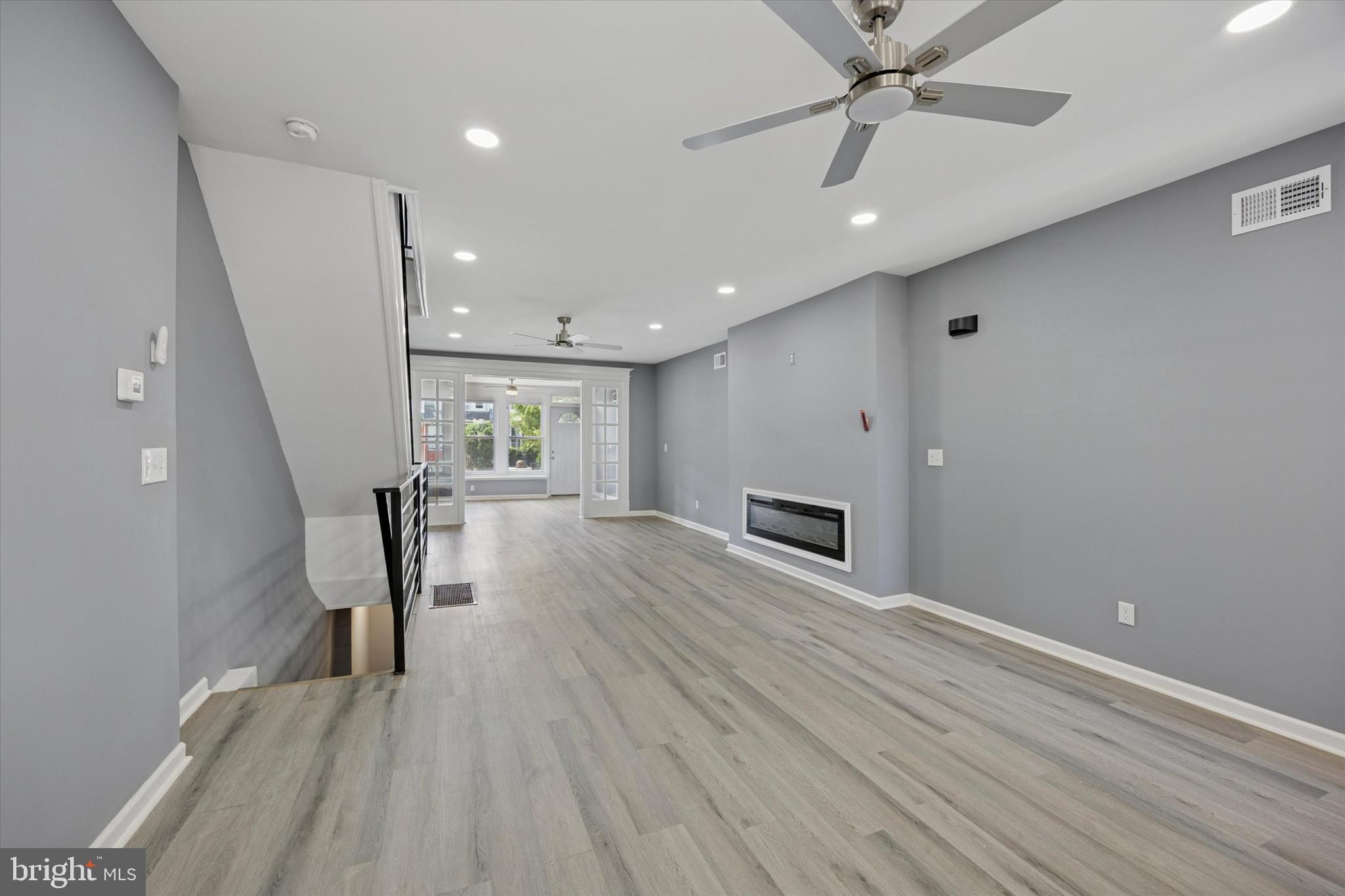 5407 Arlington Street Philadelphia, PA 19131 - Photo 5 of 15 wooden floor in an empty room with a window