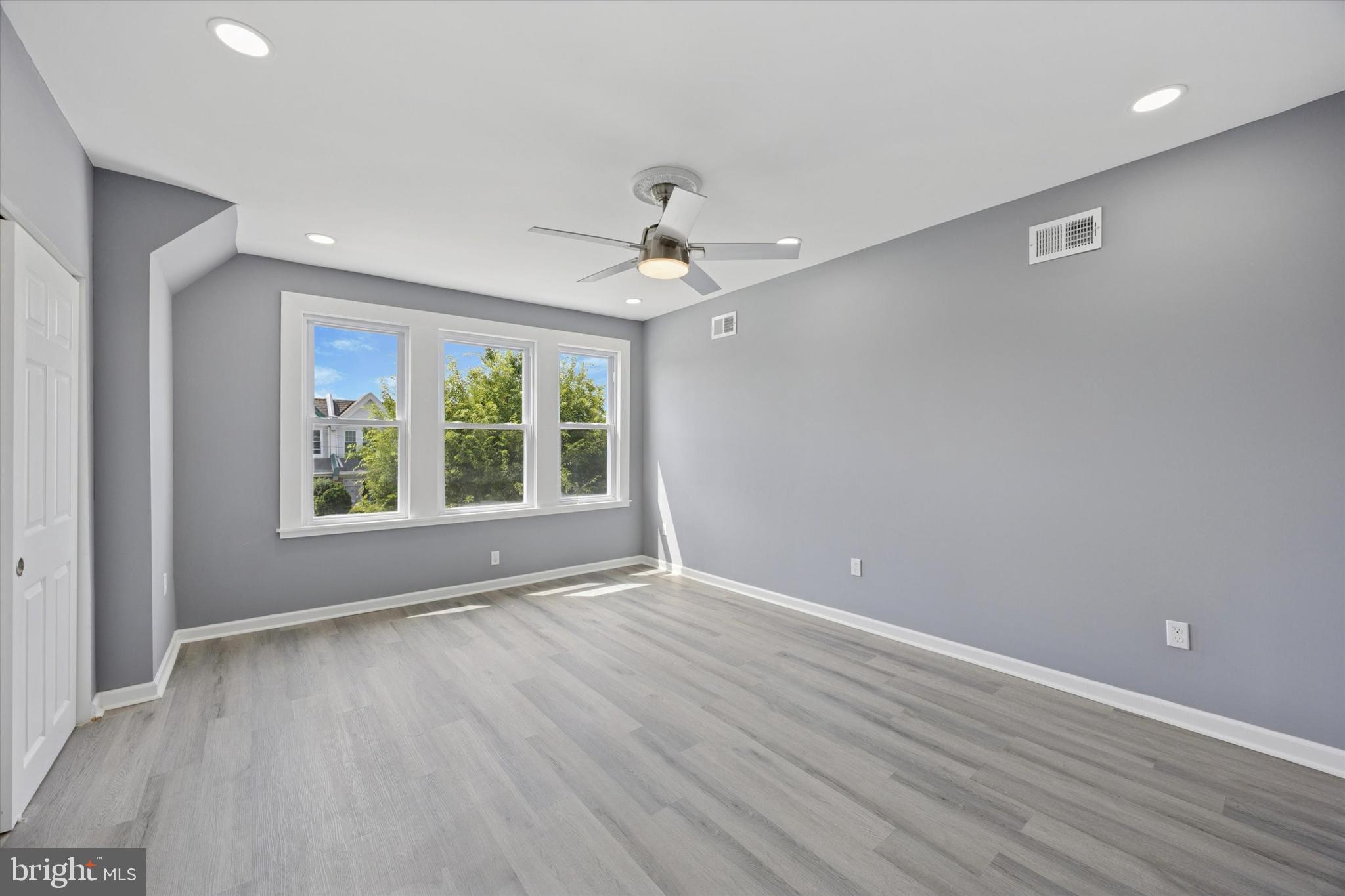 5407 Arlington Street Philadelphia, PA 19131 - Photo 9 of 15 a view of an empty room with a window and wooden floor