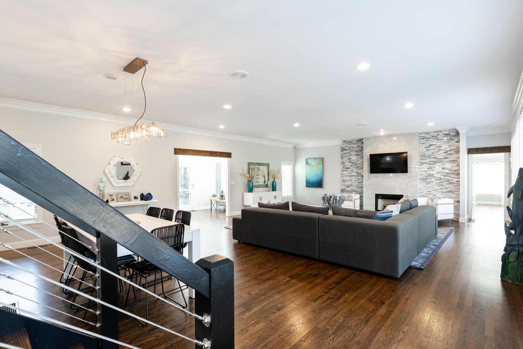 135 Paddock Circle Mashpee, MA 02649 - Photo 11 of 60 a living room with furniture flat screen tv and wooden floor
