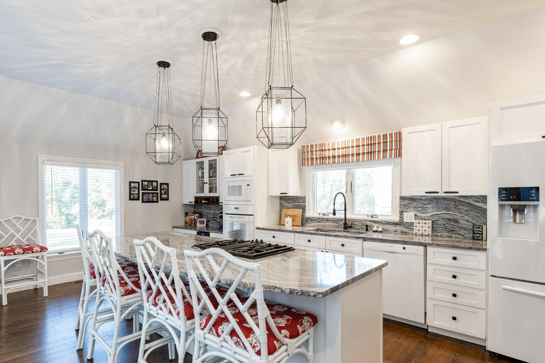 135 Paddock Circle Mashpee, MA 02649 - Photo 15 of 60 a kitchen with counter and chairs