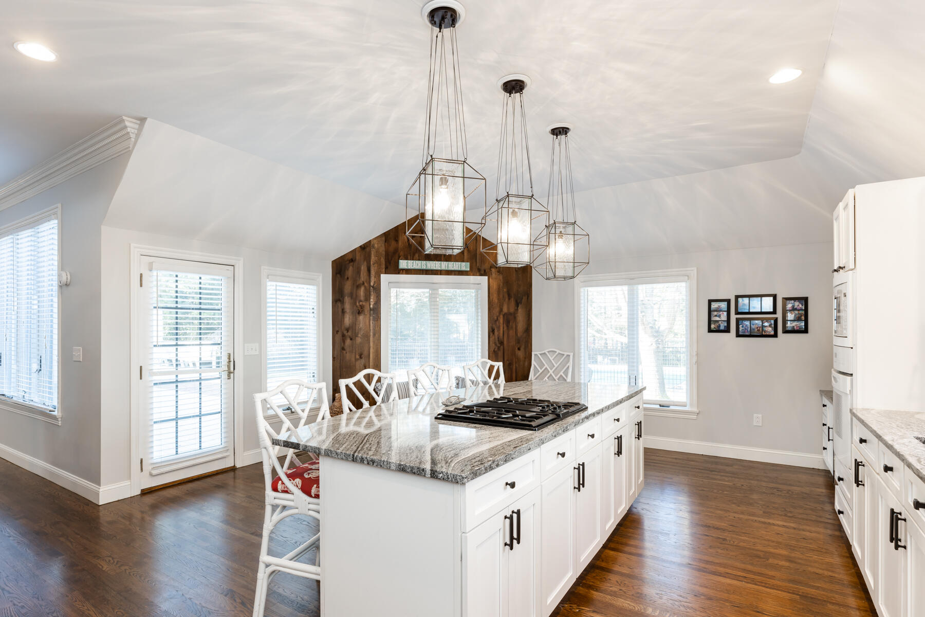 135 Paddock Circle Mashpee, MA 02649 - Photo 17 of 60 a open kitchen with stainless steel appliances granite countertop a stove and wooden floor