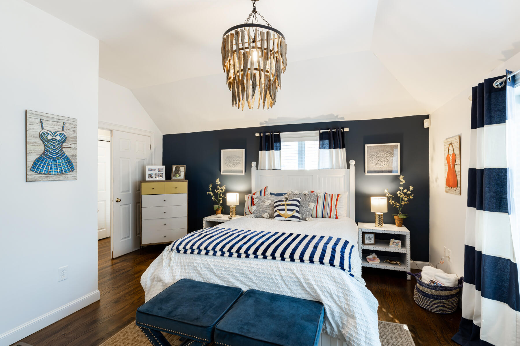 135 Paddock Circle Mashpee, MA 02649 - Photo 23 of 60 a bedroom with a bed a mirror and book shelf