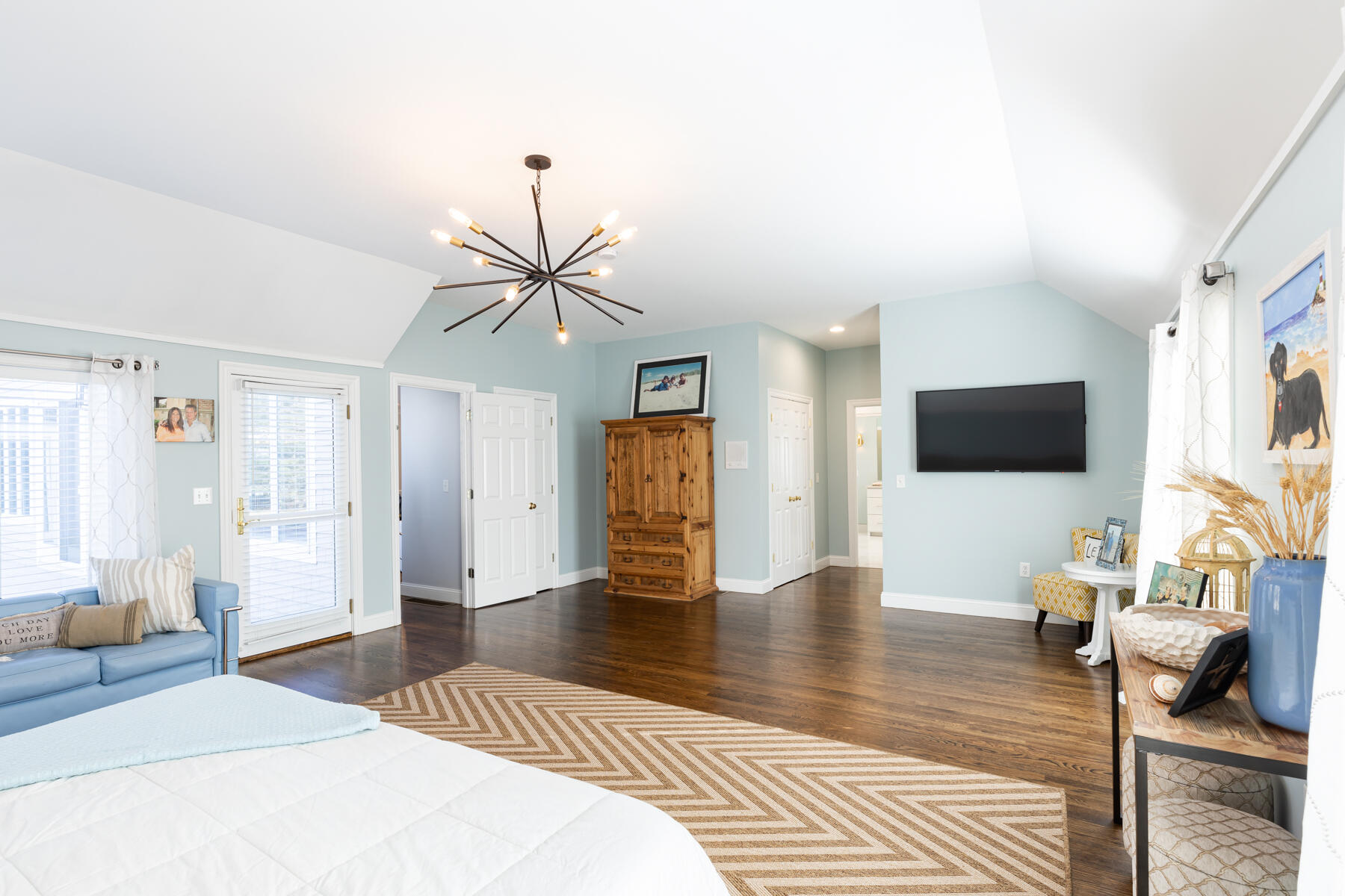 135 Paddock Circle Mashpee, MA 02649 - Photo 30 of 60 a bedroom with a bed and a flat screen tv