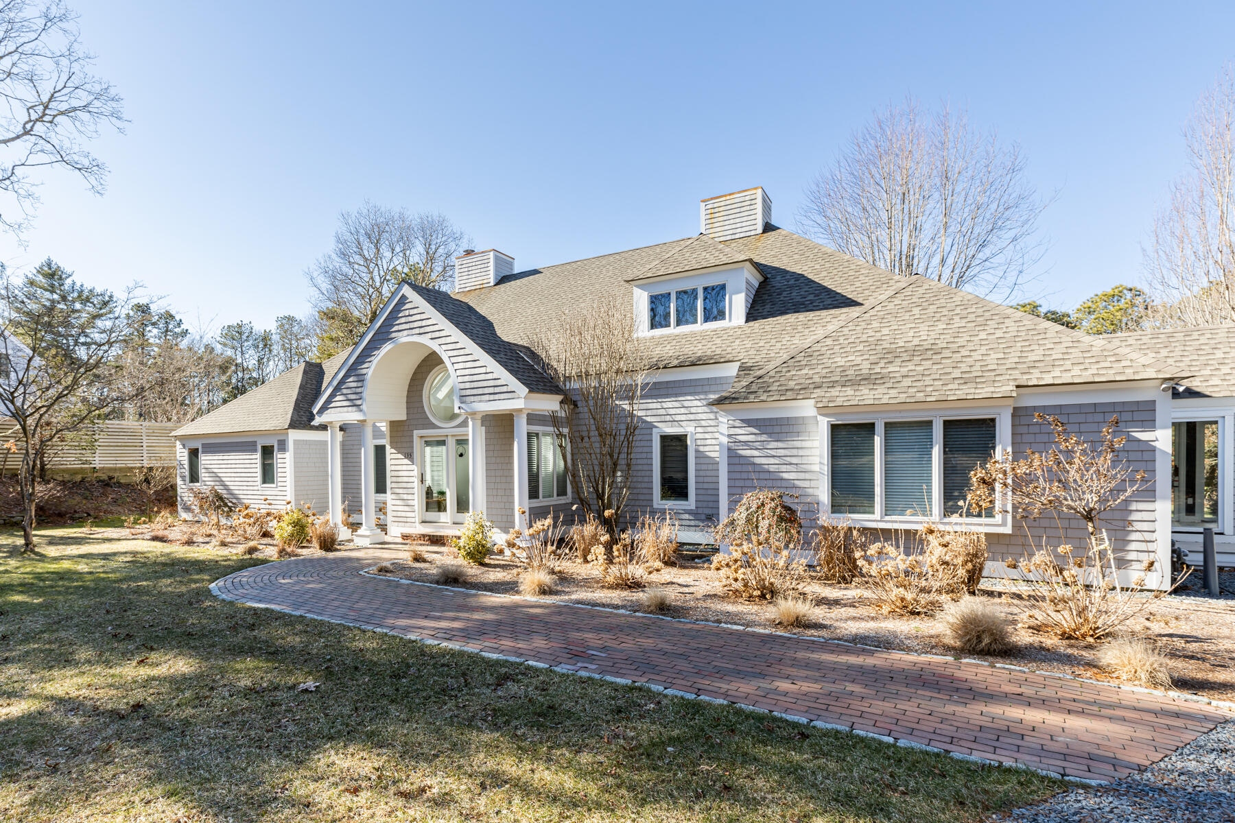 135 Paddock Circle Mashpee, MA 02649 - Photo 3 of 60 a front view of a house with garden