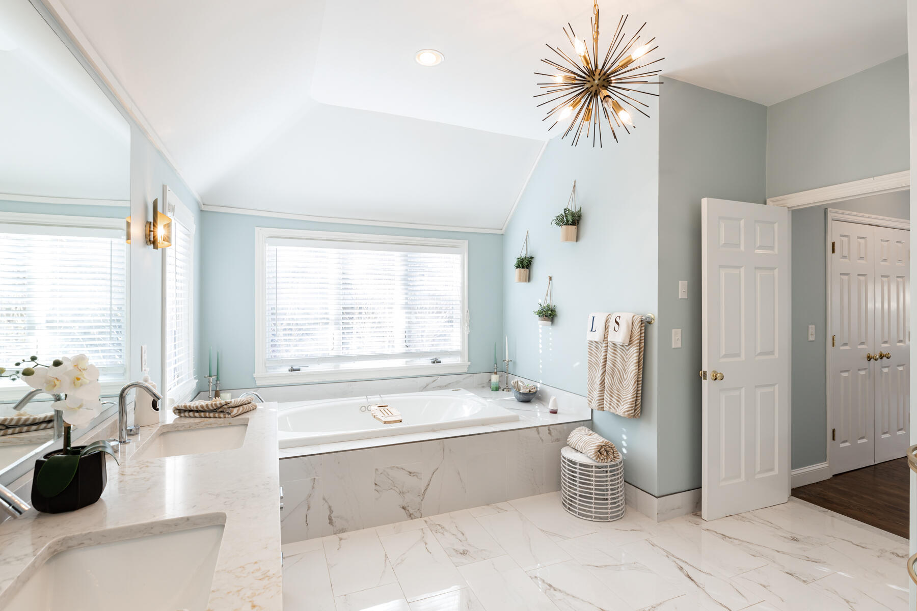 135 Paddock Circle Mashpee, MA 02649 - Photo 32 of 60 a spacious bathroom with a tub sink and a mirror