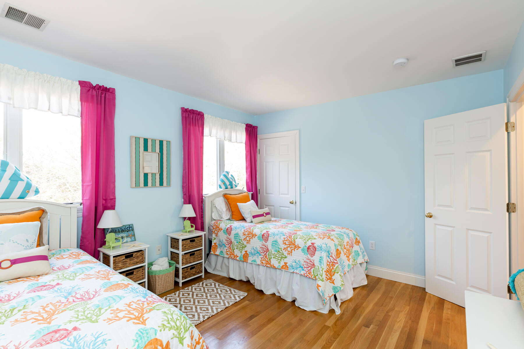 135 Paddock Circle Mashpee, MA 02649 - Photo 39 of 60 a bedroom with a bed and wooden floor