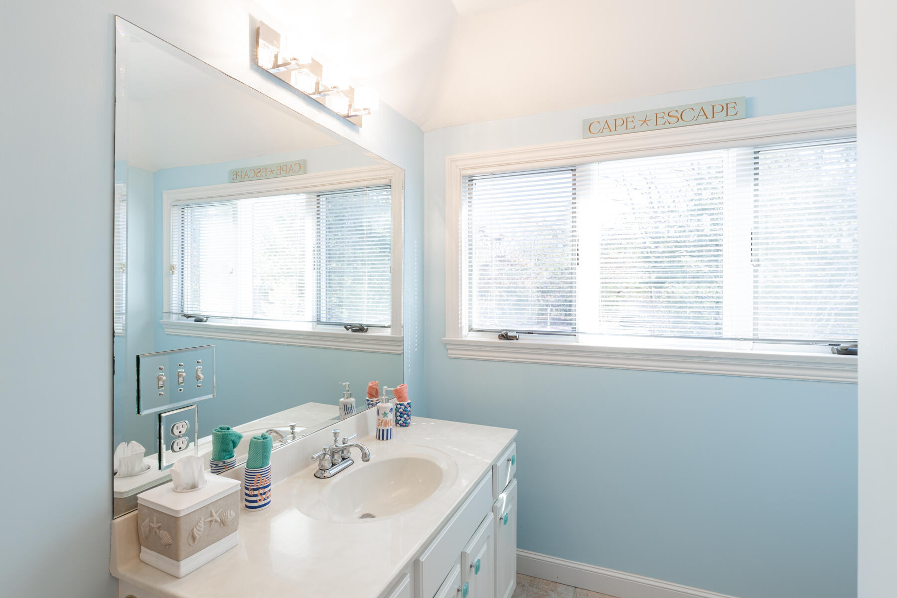 135 Paddock Circle Mashpee, MA 02649 - Photo 40 of 60 a bathroom with a sink a vanity and a window