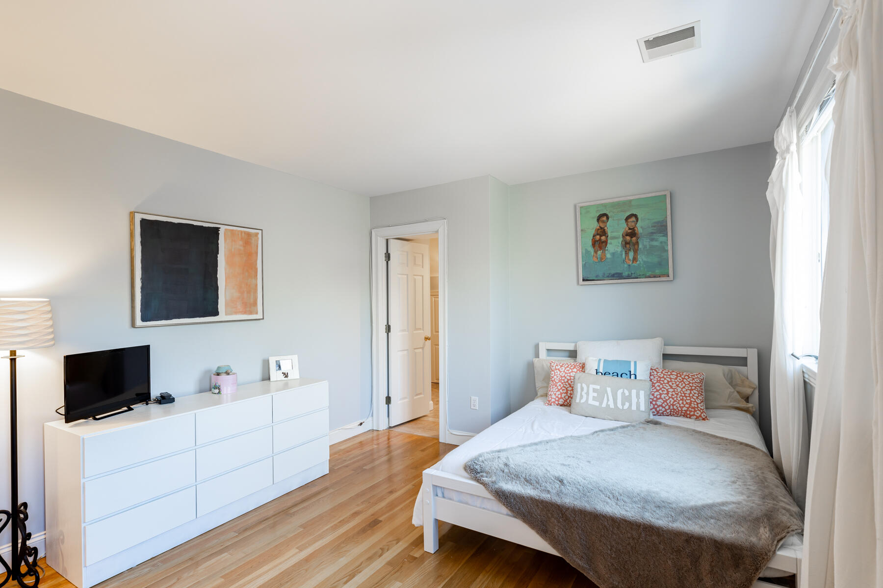 135 Paddock Circle Mashpee, MA 02649 - Photo 42 of 60 a bedroom with a bed and a flat screen tv