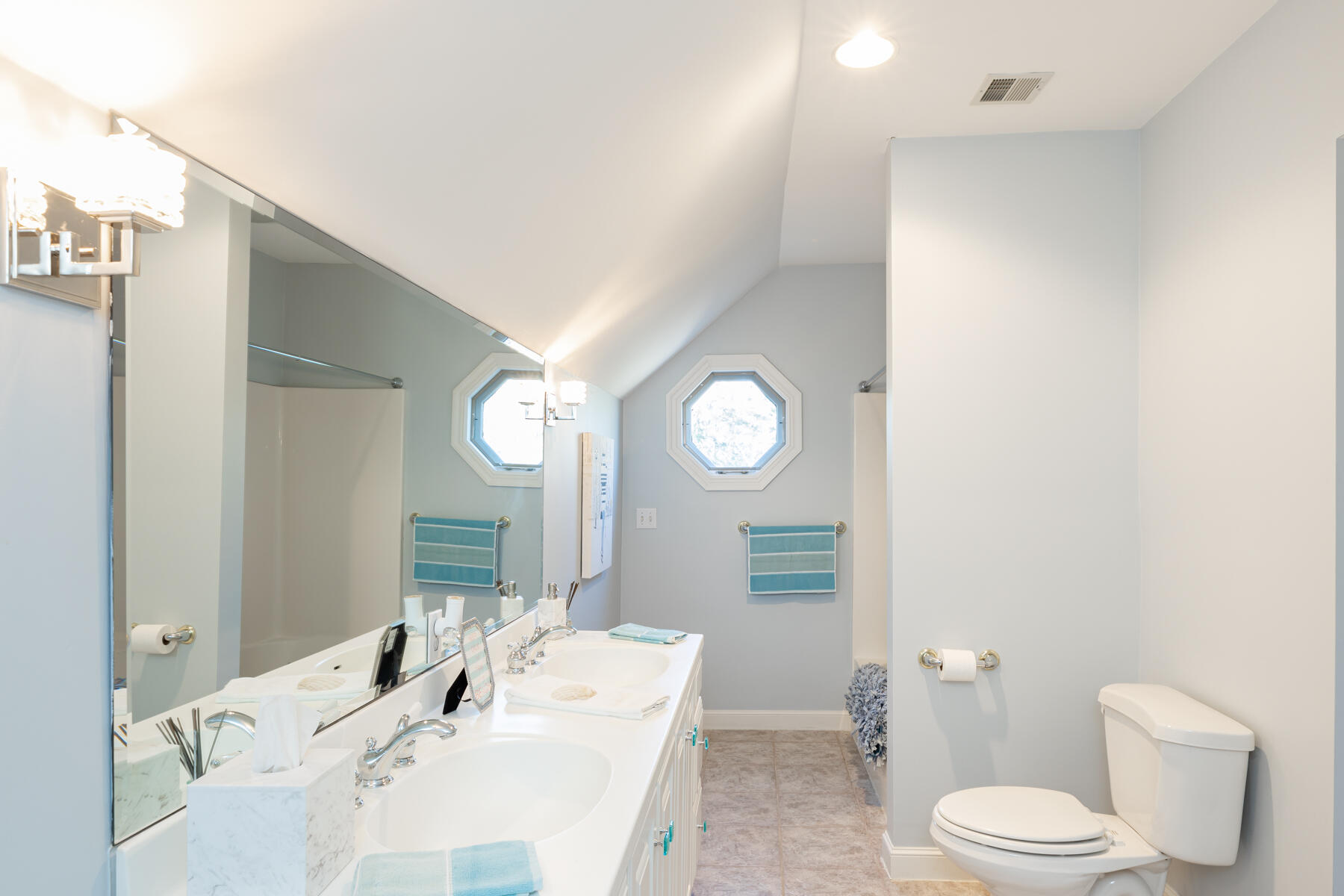 135 Paddock Circle Mashpee, MA 02649 - Photo 44 of 60 a bathroom with a toilet a sink and a large mirror