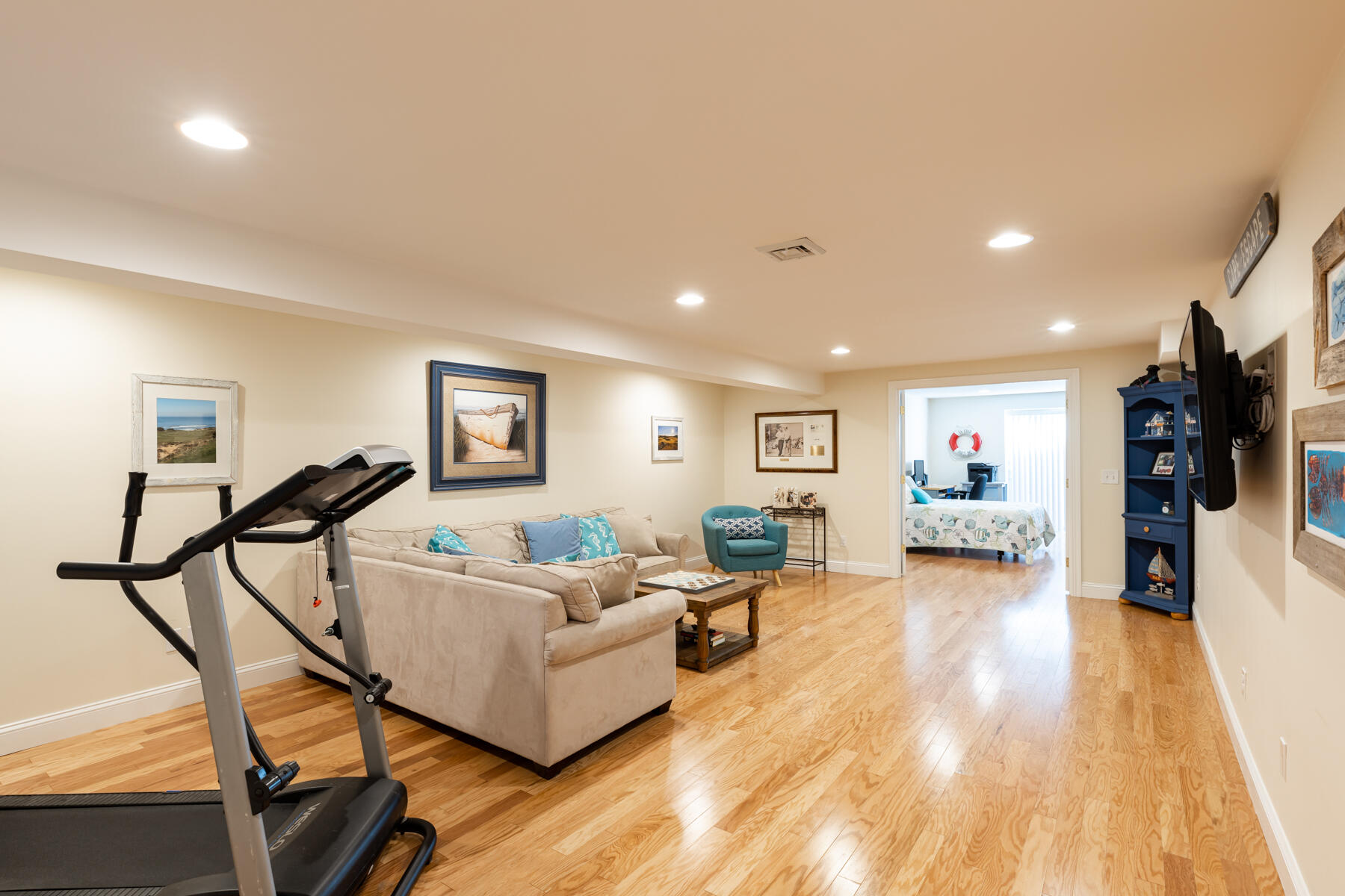 135 Paddock Circle Mashpee, MA 02649 - Photo 45 of 60 a living room with furniture and a wooden floor