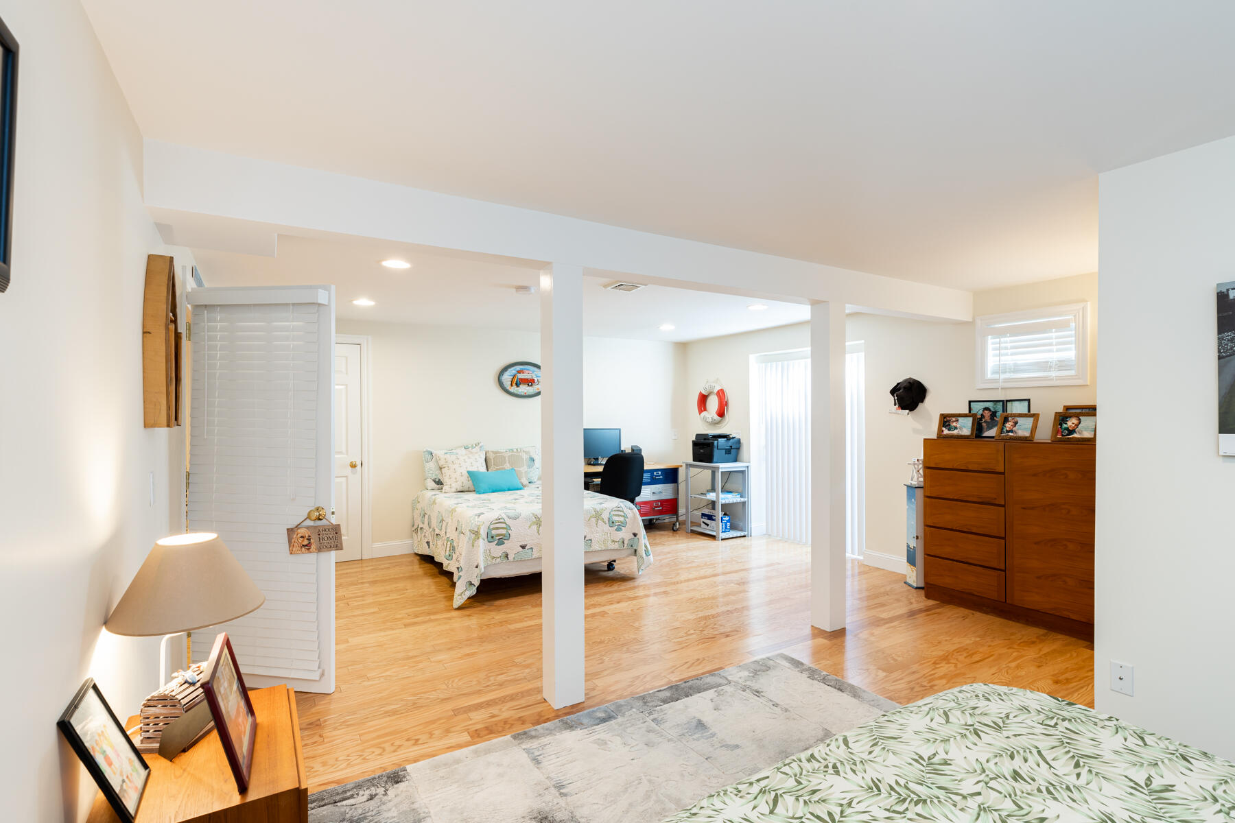 135 Paddock Circle Mashpee, MA 02649 - Photo 49 of 60 a living room with furniture and a wooden floor