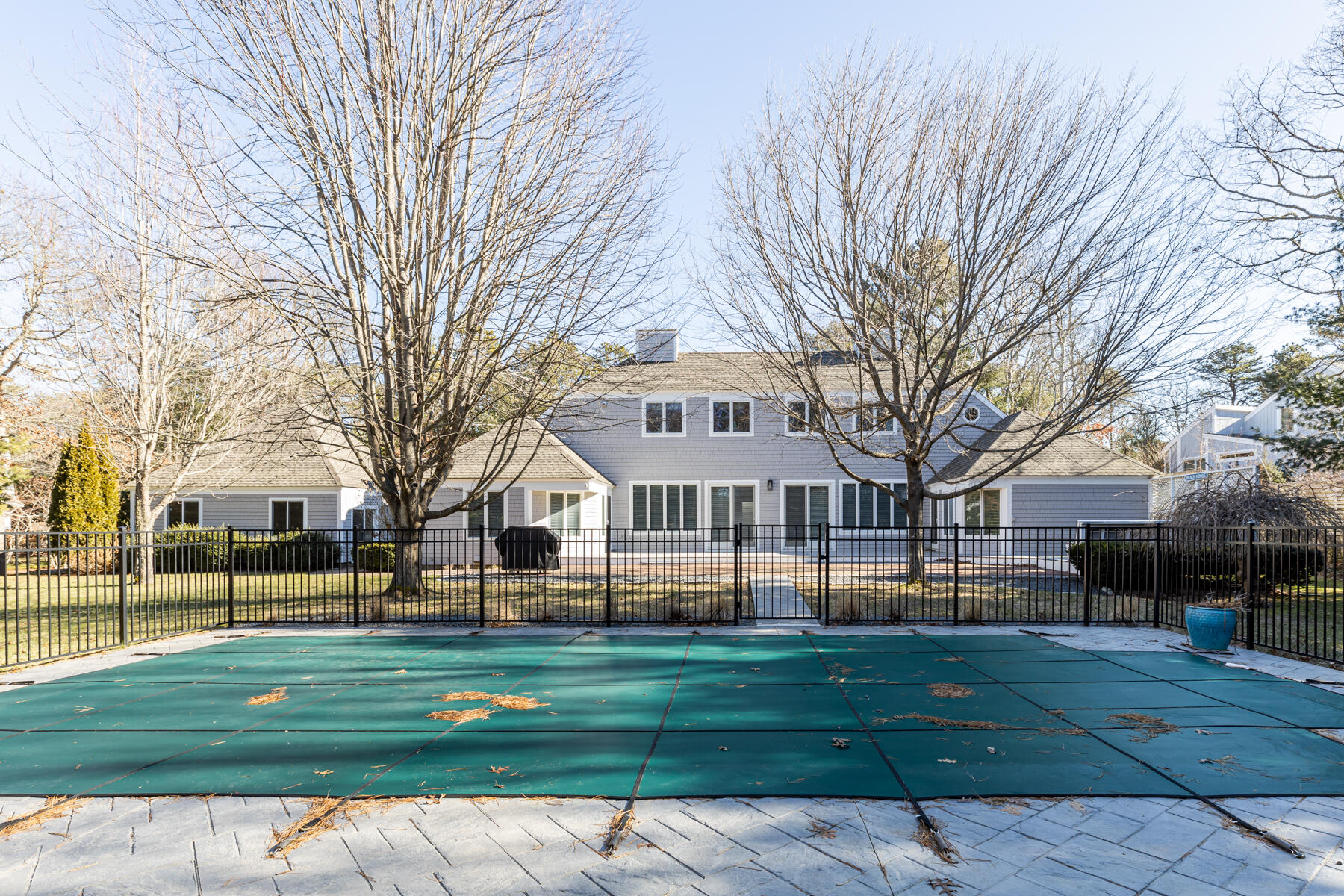 135 Paddock Circle Mashpee, MA 02649 - Photo 52 of 60 a front view of a building with a garden