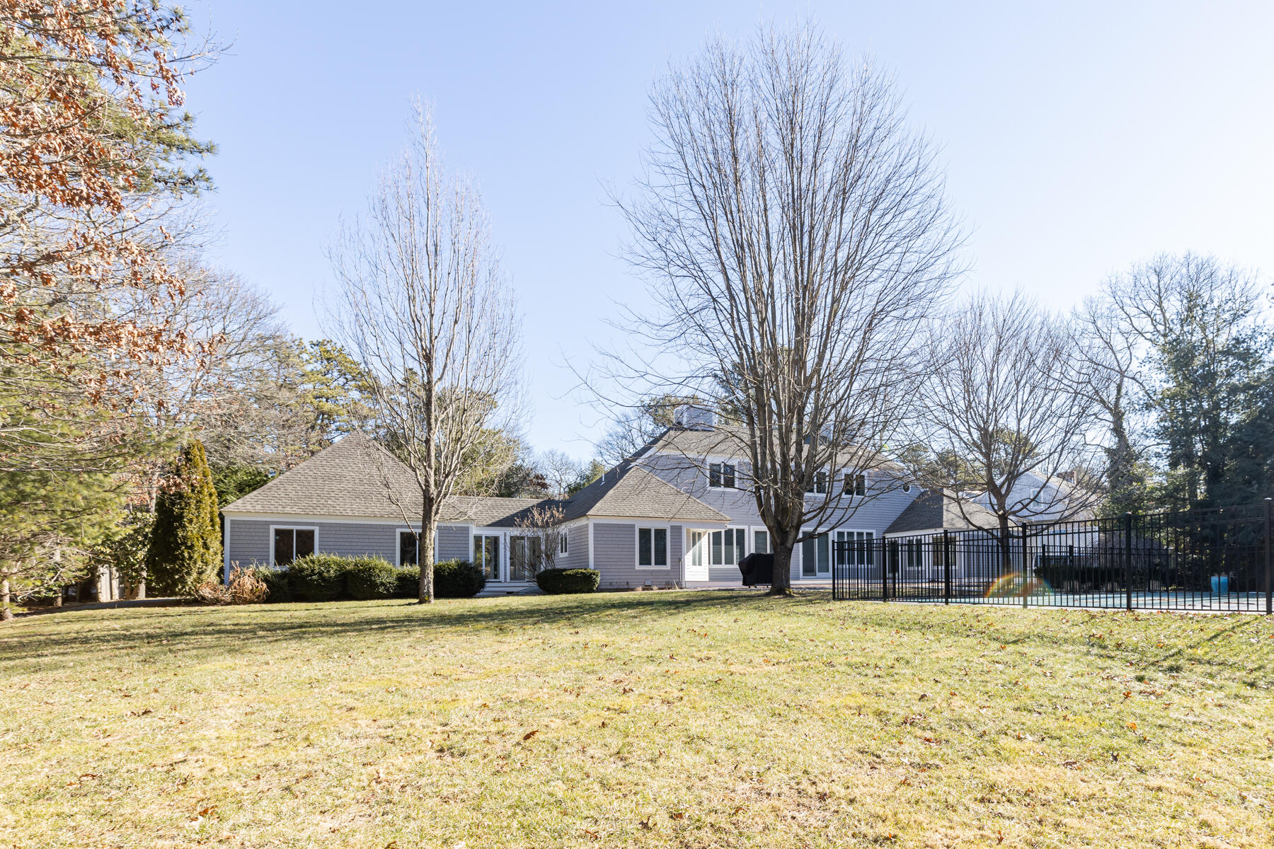 135 Paddock Circle Mashpee, MA 02649 - Photo 53 of 60 a front view of house with yard and trees