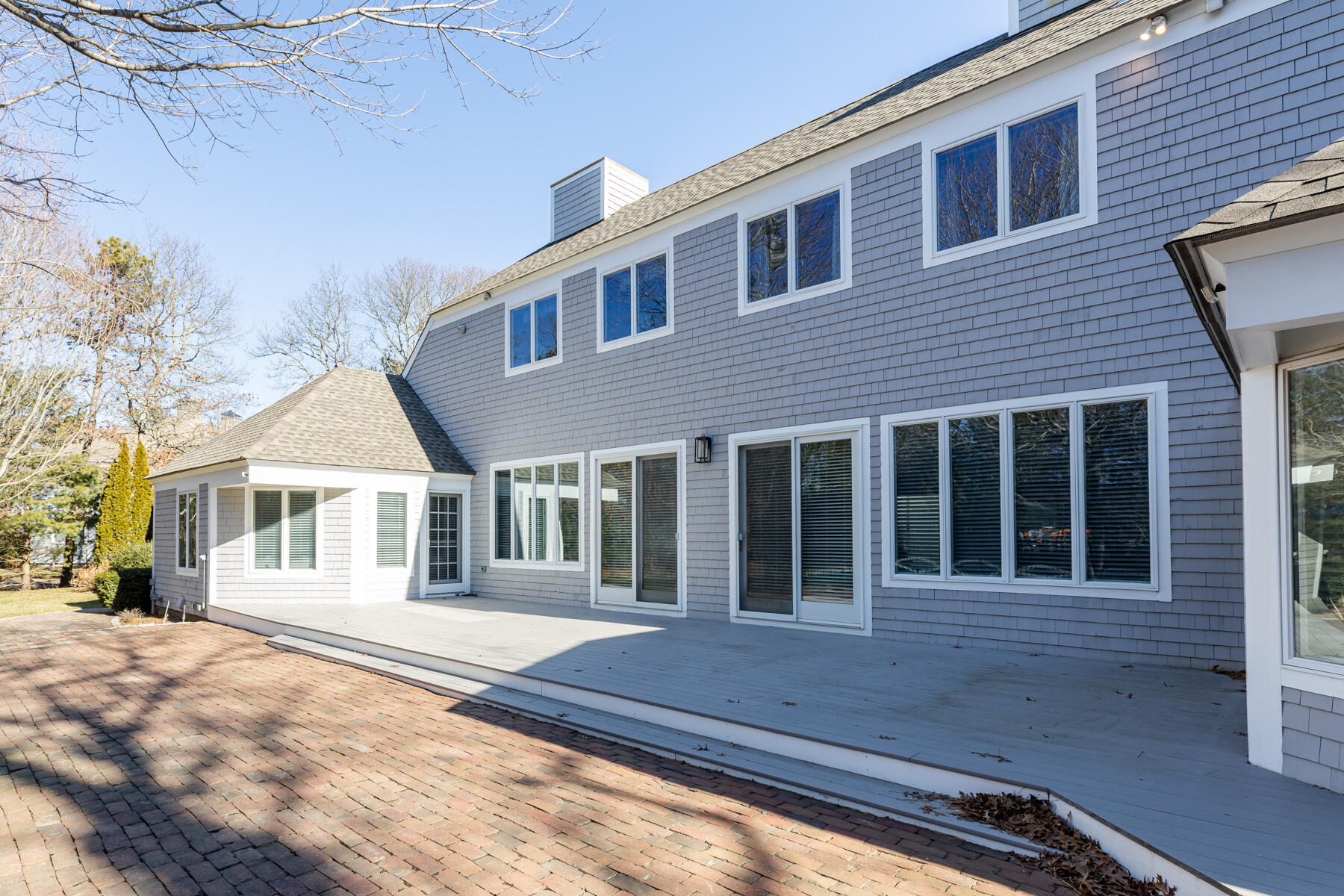 135 Paddock Circle Mashpee, MA 02649 - Photo 54 of 60 a front view of a house with a yard