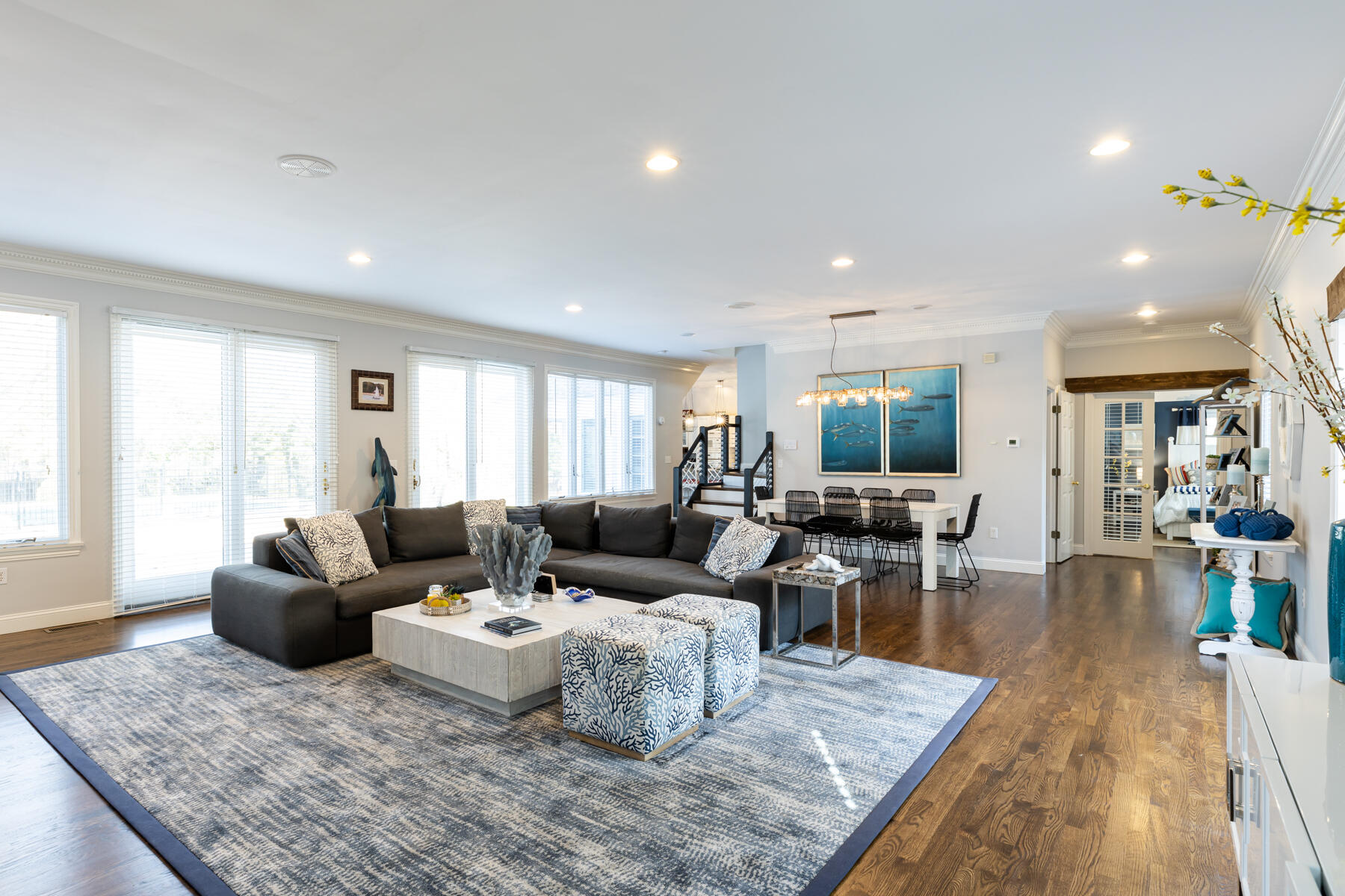 135 Paddock Circle Mashpee, MA 02649 - Photo 7 of 60 a living room with furniture wooden floor and a rug