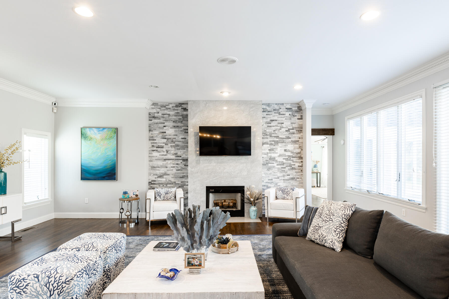 135 Paddock Circle Mashpee, MA 02649 - Photo 8 of 60 a living room with furniture a fireplace and a flat screen tv