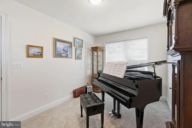 a bedroom with a bed and a bookshelf