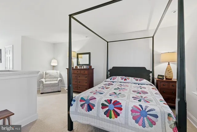 a bedroom with a bed and a dresser