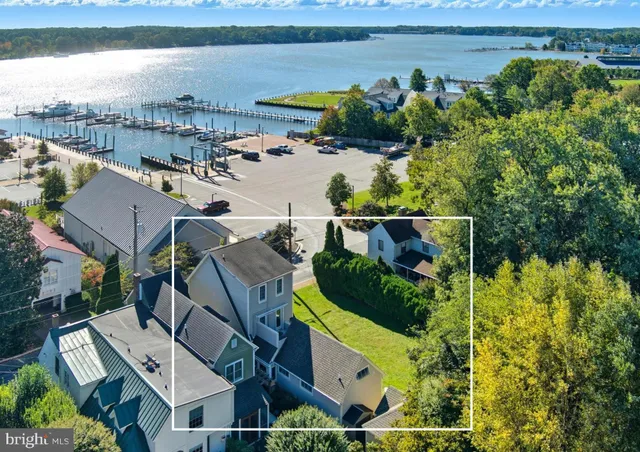 an aerial view of a house with a lake view