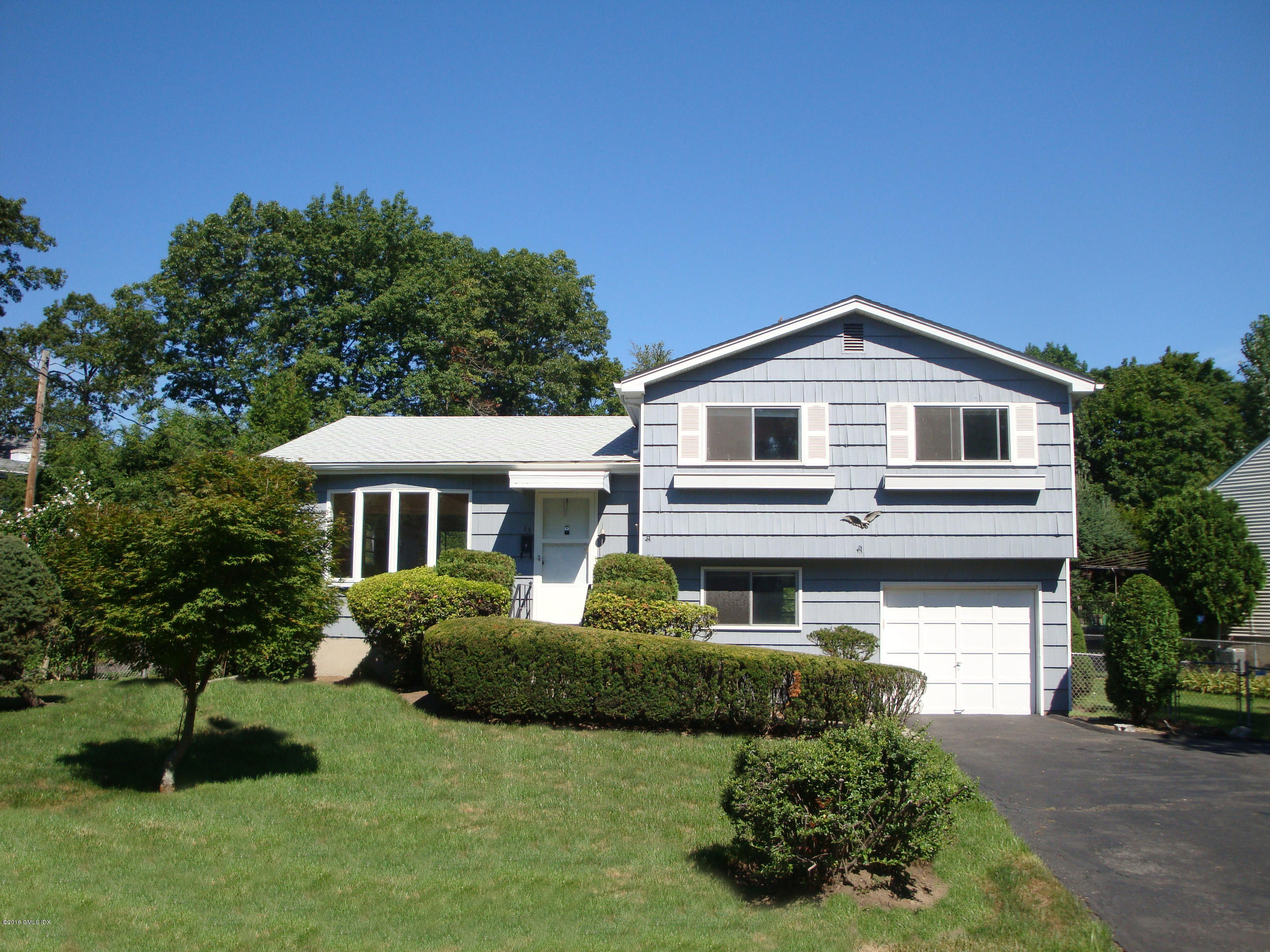 15 Amherst Road Riverside, CT 06878 - Photo 1 of 27 a front view of a house with a yard