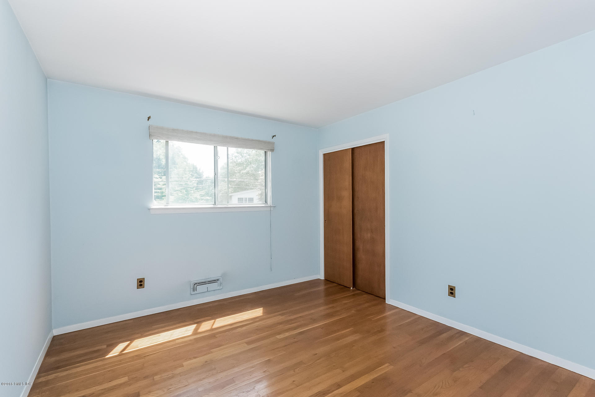 15 Amherst Road Riverside, CT 06878 - Photo 16 of 27 a view of an empty room with wooden floor and a window