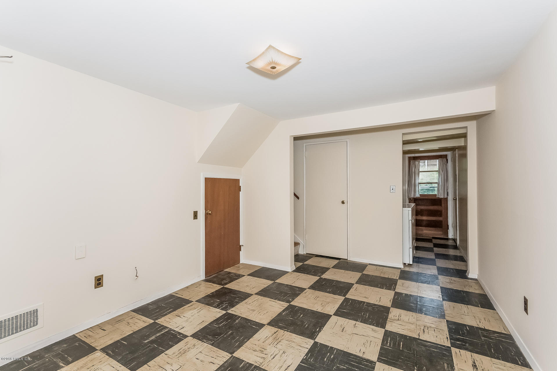 15 Amherst Road Riverside, CT 06878 - Photo 18 of 27 a view of a bathroom with a black and white checkered floor