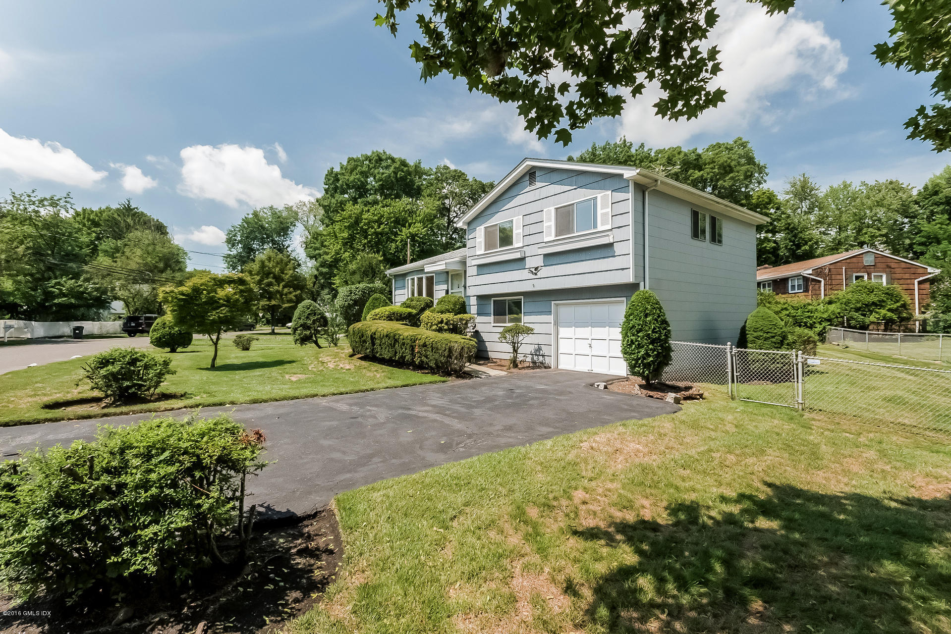 15 Amherst Road Riverside, CT 06878 - Photo 3 of 27 a front view of a house with garden
