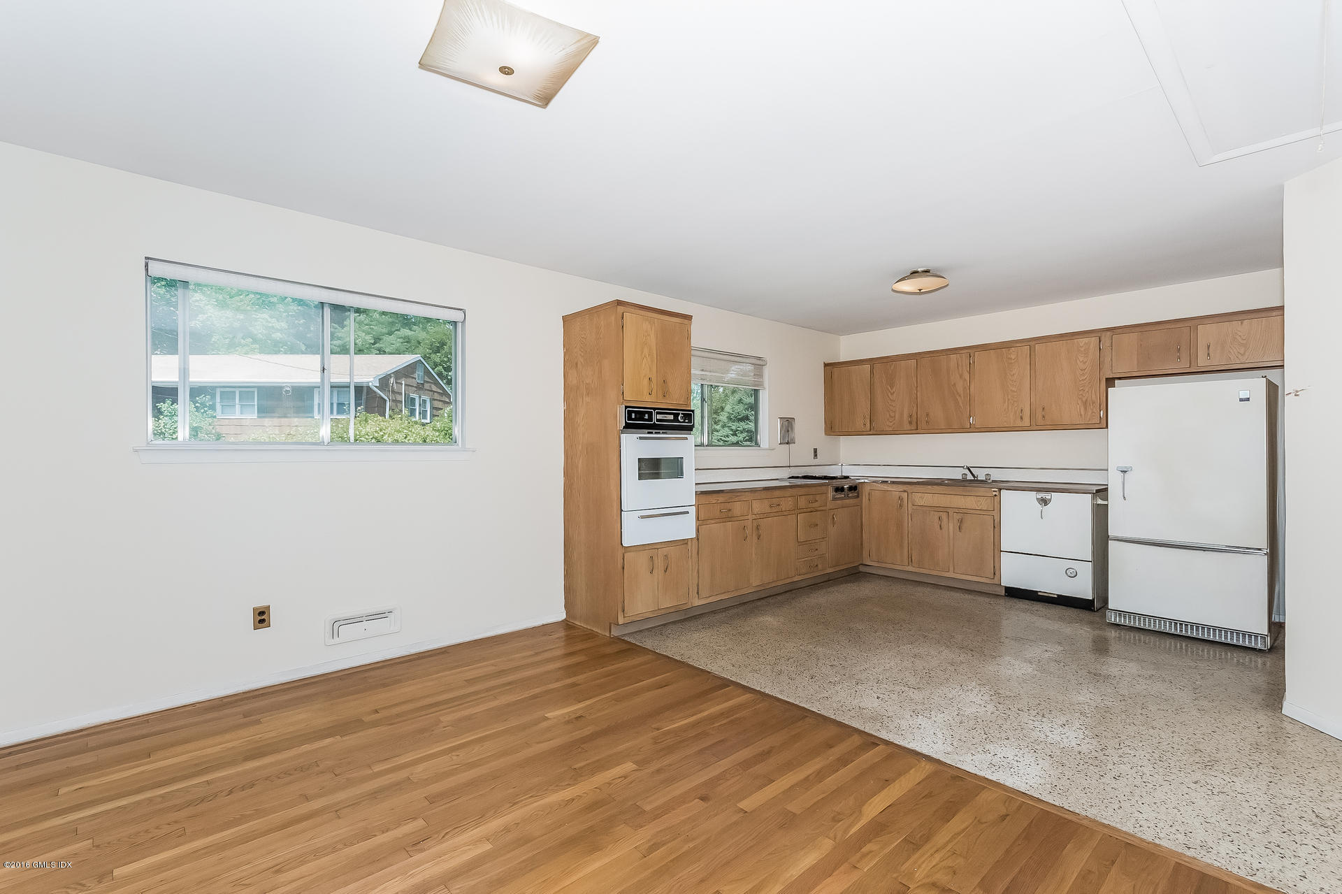 15 Amherst Road Riverside, CT 06878 - Photo 8 of 27 a kitchen with a white cabinets and white appliances