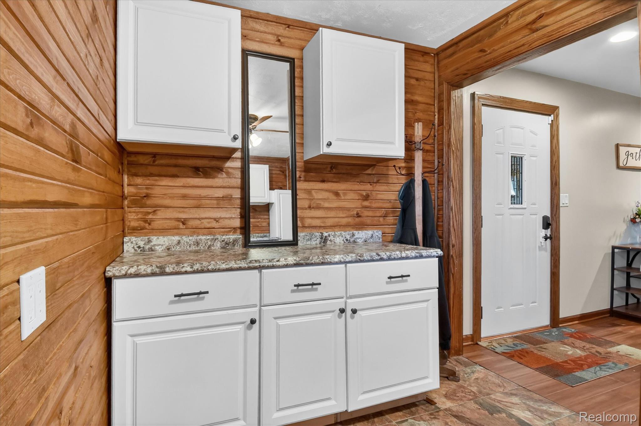 3949 West Burns Line Road Brown City, MI 48416 - Photo 43 of 70 Built-in cabinetry with white shaker-style doors and dark hardware