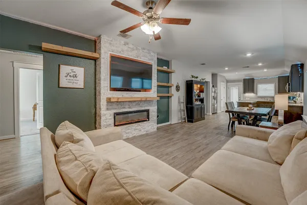 a living room with furniture and a fireplace