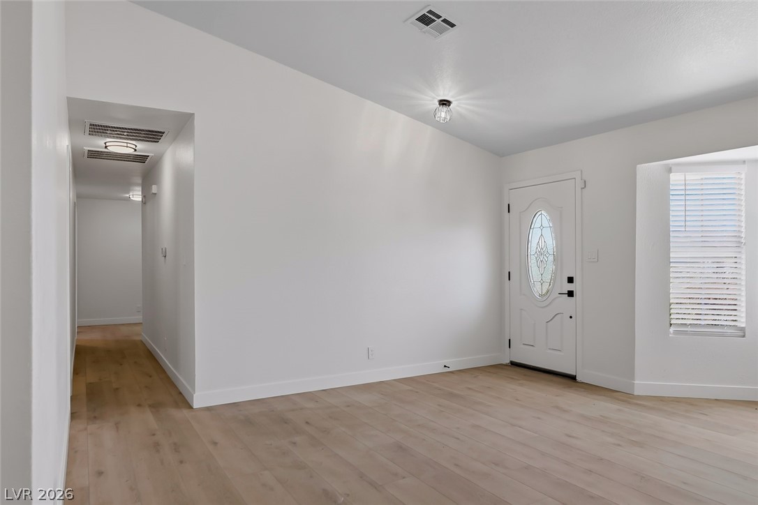 434 Crestway Road Henderson, NV 89015 - Photo 11 of 46 Foyer entrance with light wood finished floors and baseboards