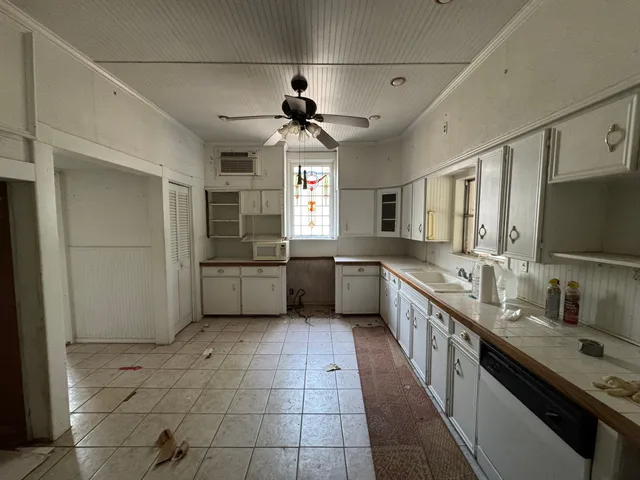 a bathroom with a sink toilet and a mirror