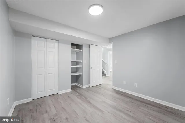 an empty room with closet area