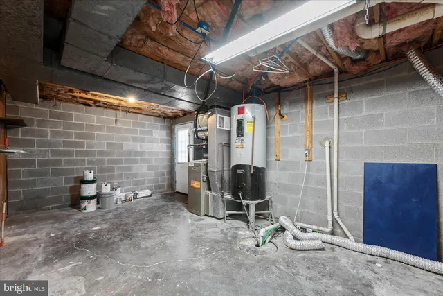 a view of empty room with wooden walls