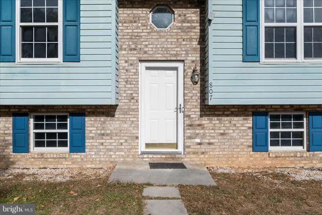 a front view of a house with large windows