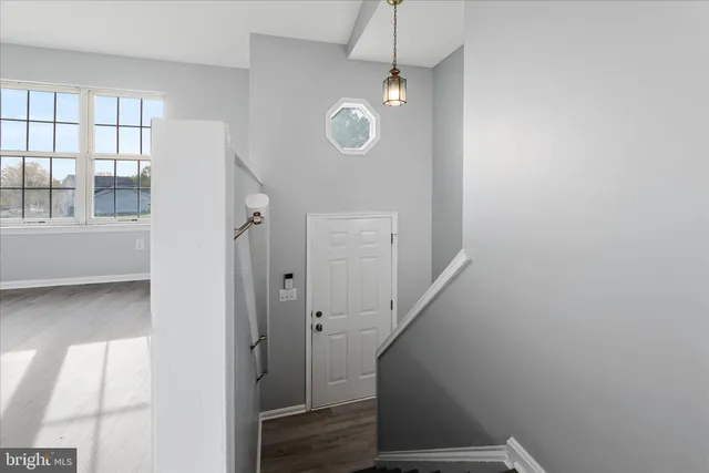 a view of entryway with wooden floor