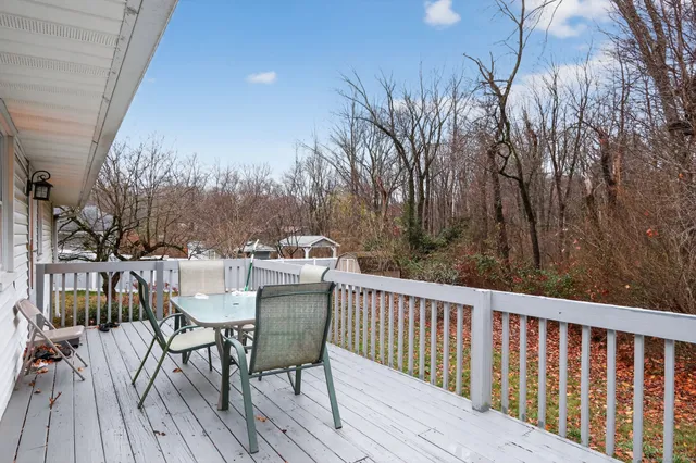 a view of a chairs and table on the deck
