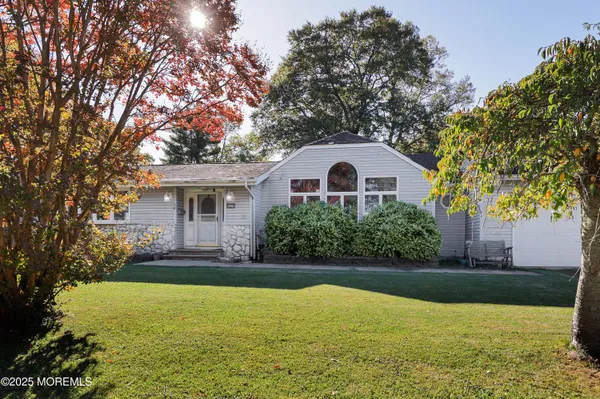 an aerial view of a house with a swimming pool