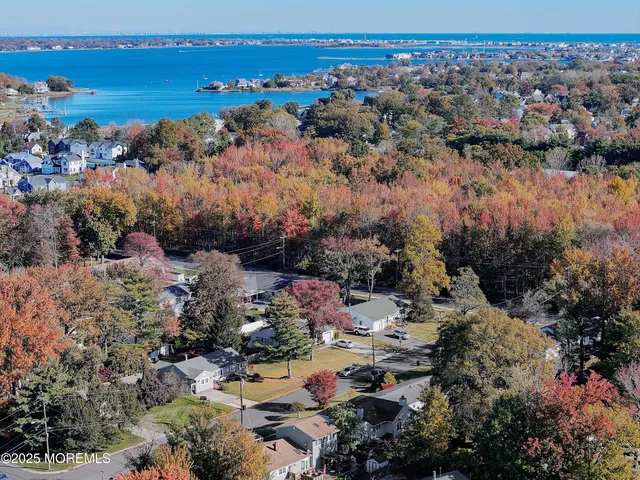 a view of a house with a yard and garage