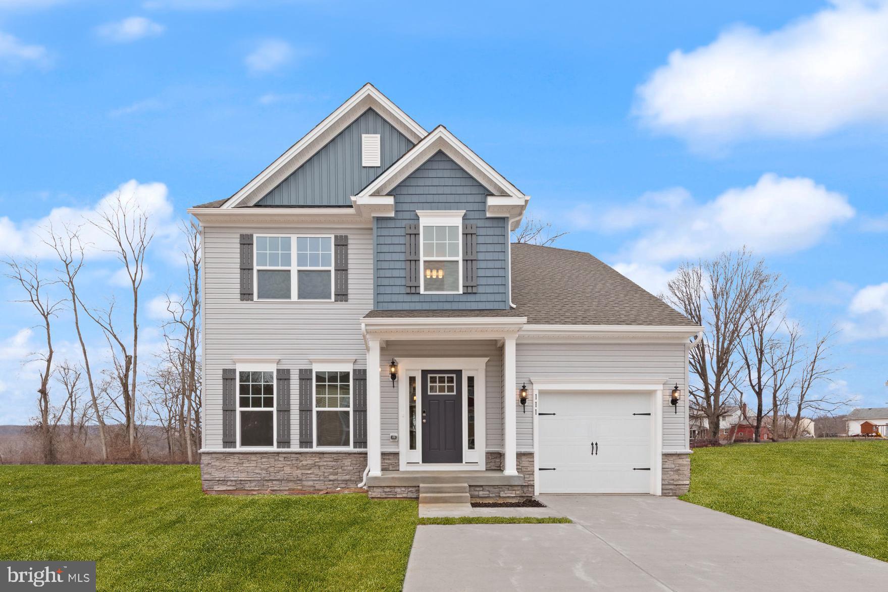 front view of a house with a yard