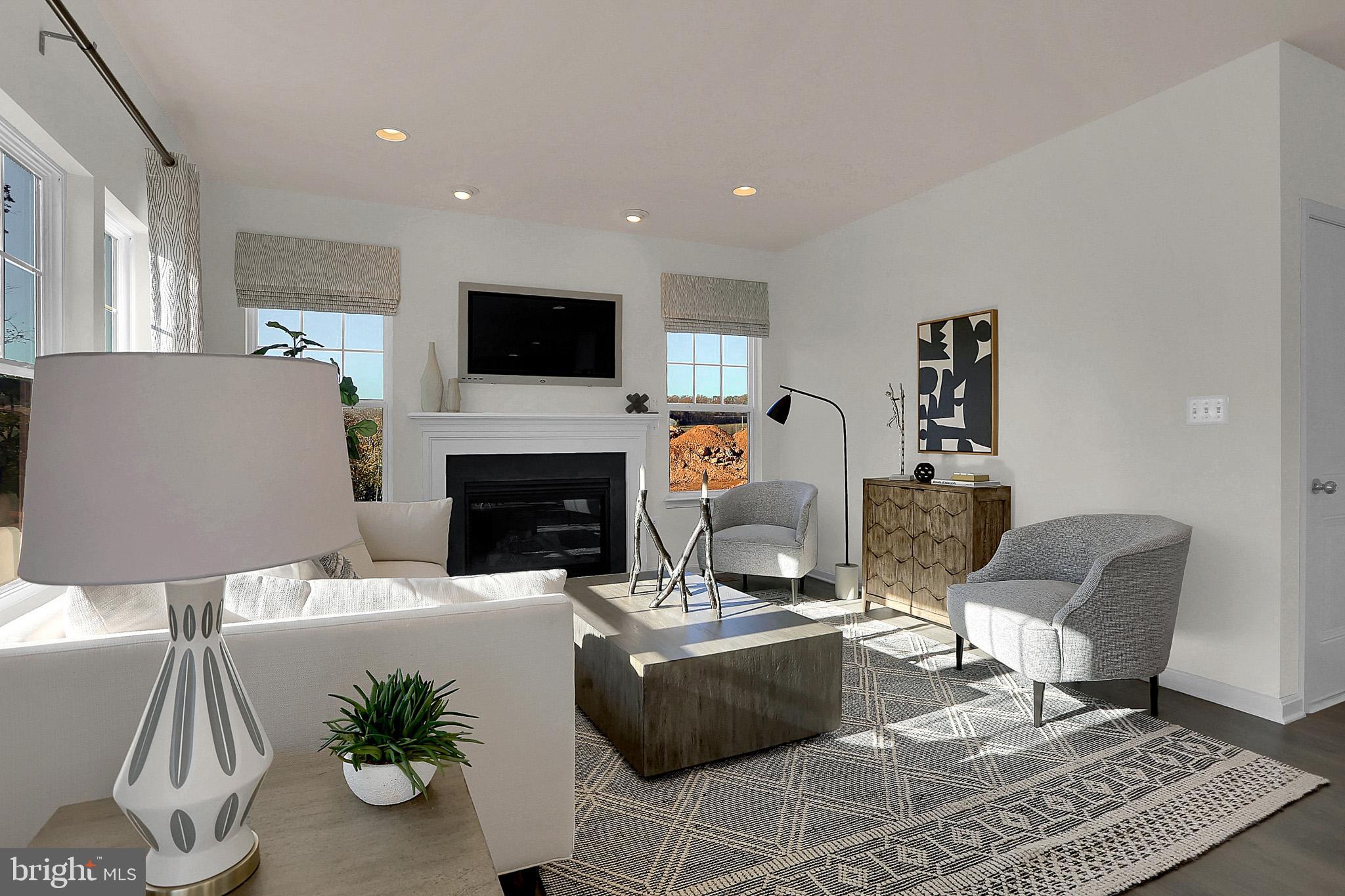 111 Nell Street Perryville, MD 21903 - Photo 10 of 22 a living room with furniture a flat screen tv and a fireplace